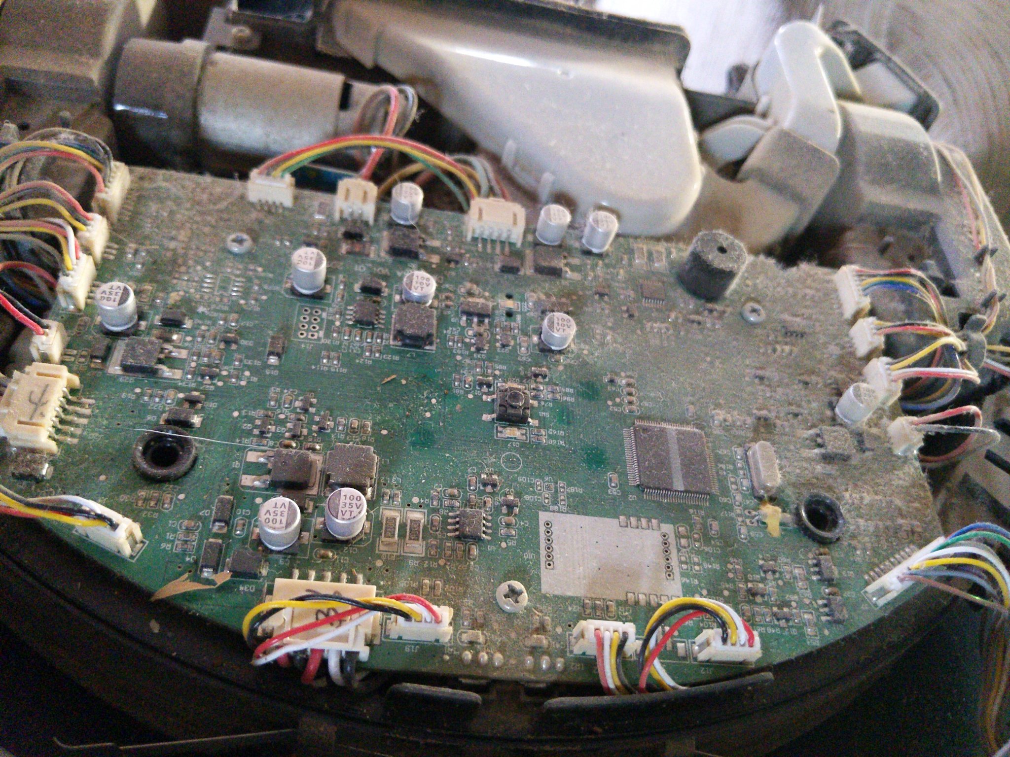 very dusty motherboard and other electronic parts.