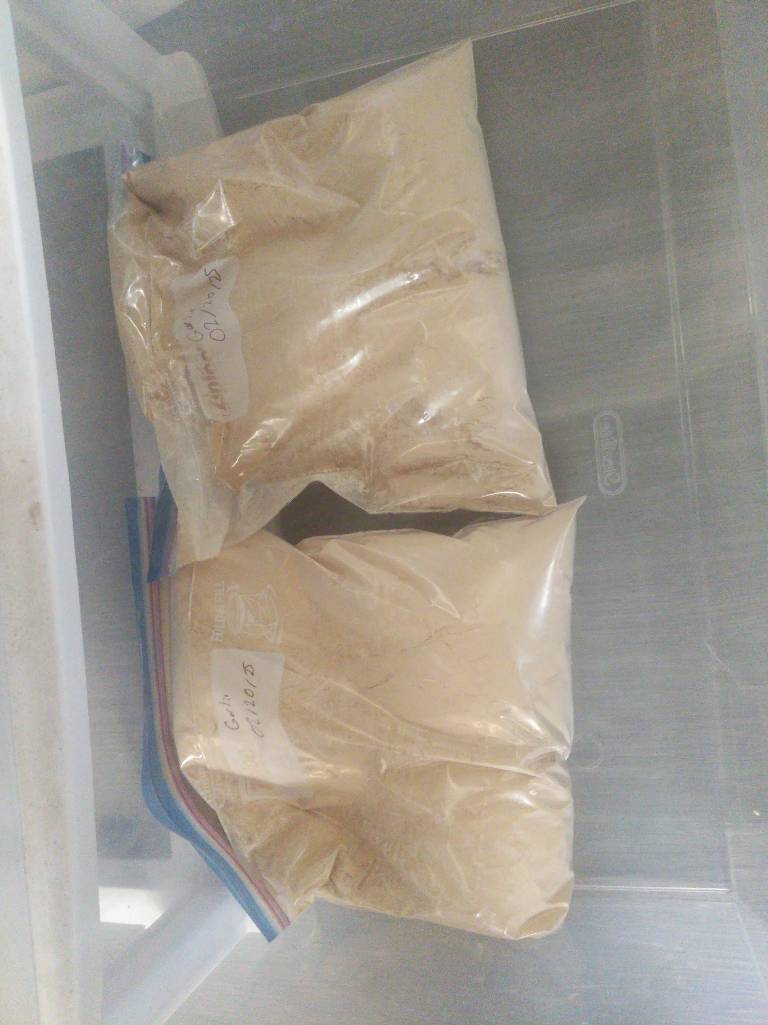 Two 1-gallon plastic bags of garlic powder.