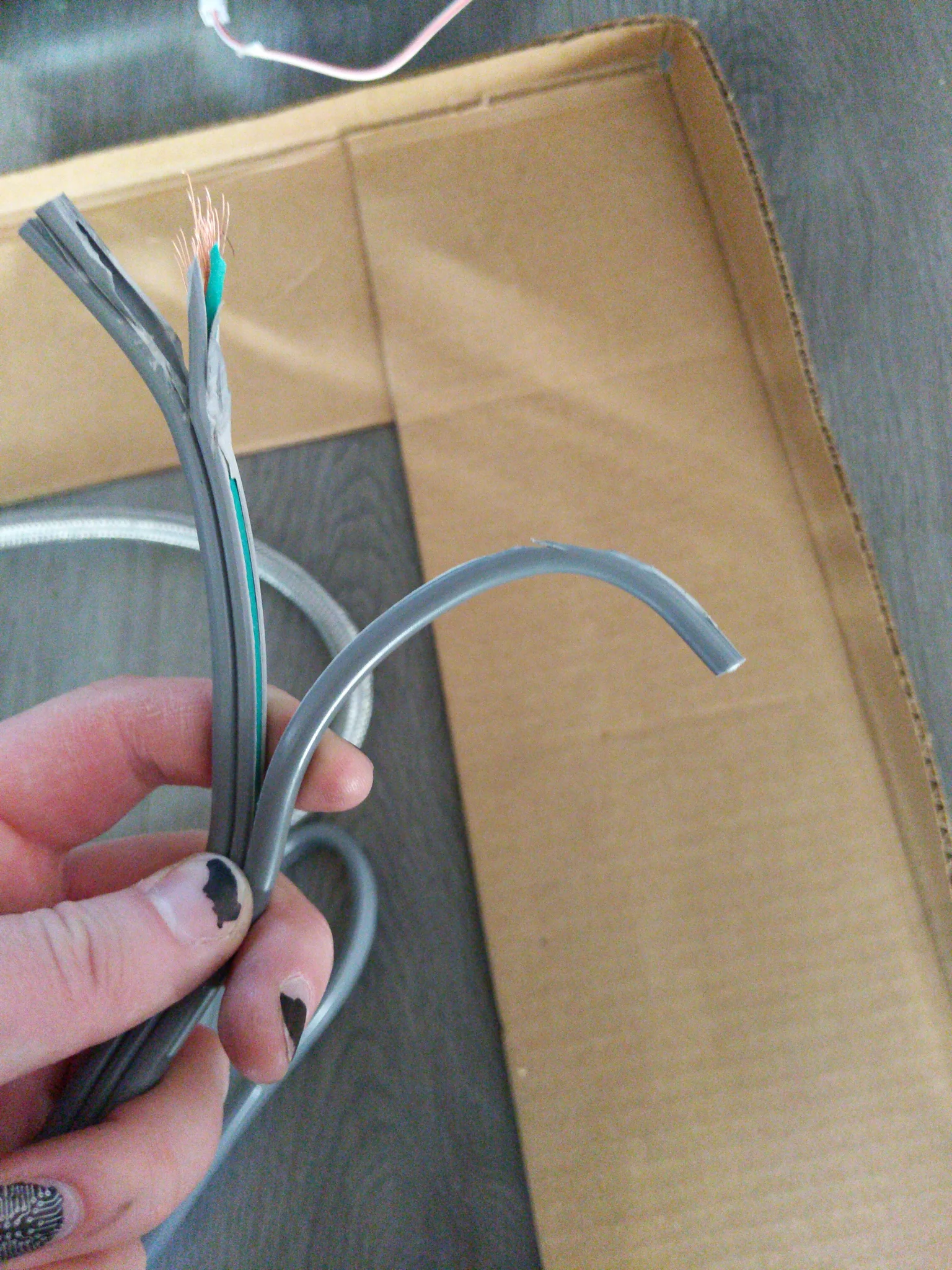 the end of a high capacity power cable that has had its the lines pulled apart. it looks like those twizzlers candy you can pull apart.