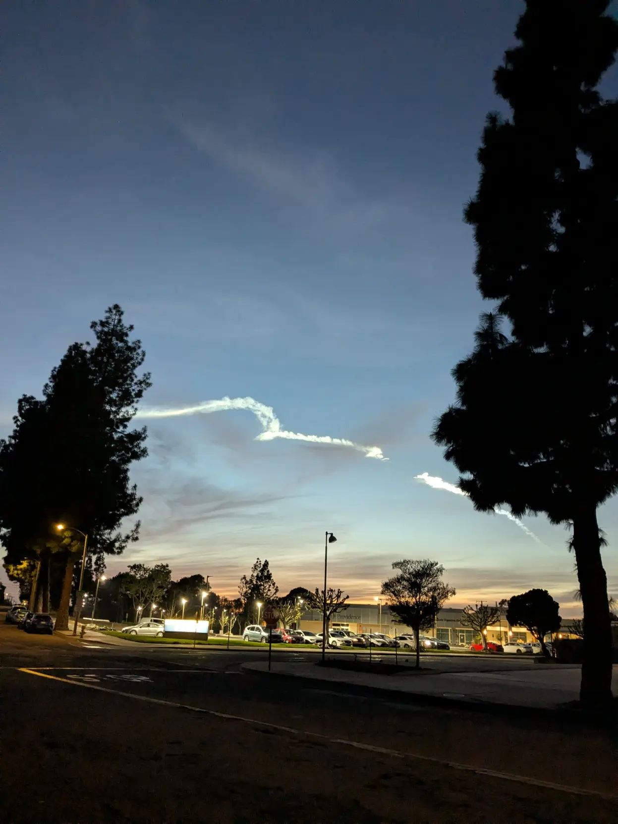 A rocket path with trees in the foreground
