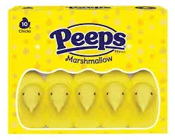 a box of peeps candy. They are little marhsmallows covered in yellow sprinkles shaped and decorated to look like baby chicks